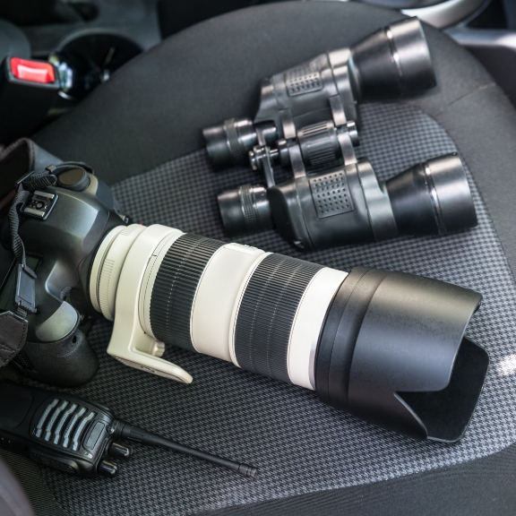 Some surveillance equipment on a car seat.